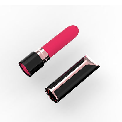 Open pink lipstick-style vibrator beside cap