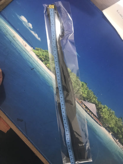 Black flogger shown inside clear packaging