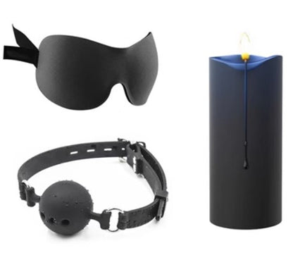 Blue candle with black eye mask and ball gag