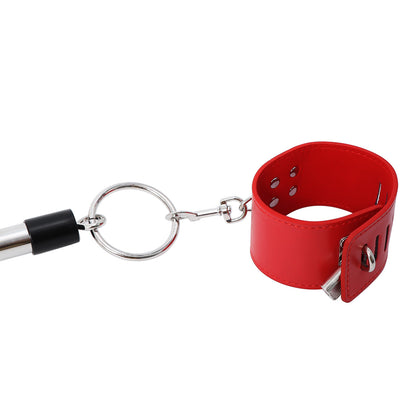 Close-up of red cuff and metal attachment ring