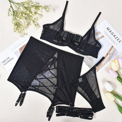 Black mesh bra and garter skirt displayed flat