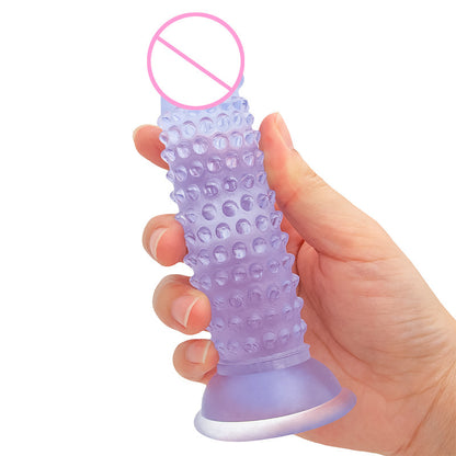 Clear blue textured toy held for scale