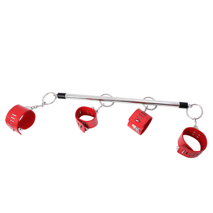 Metal spreader bar and red cuffs
