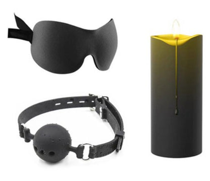 Yellow candle with black eye mask and ball gag