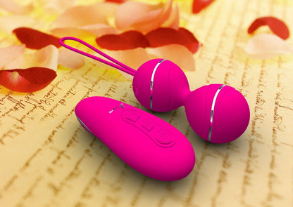 Bright pink vibrating balls and remote