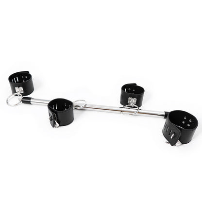 Metal restraint bar with four black cuffs
