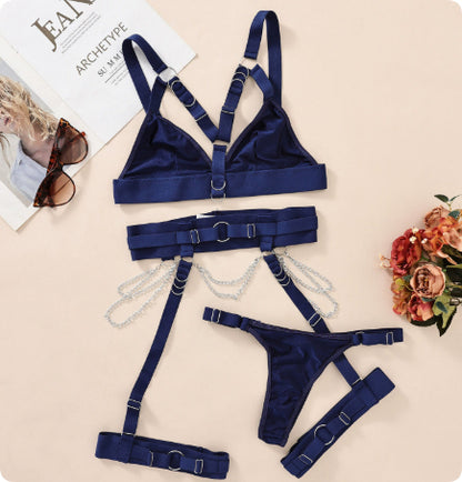 Navy strappy harness lingerie displayed flat