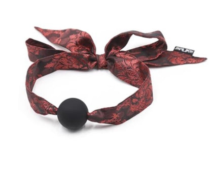 Black ball gag with red patterned tie straps