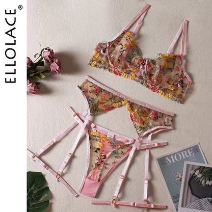 Pink floral embroidered lingerie set displayed flat