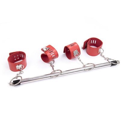 Metal spreader bar with four red cuffs