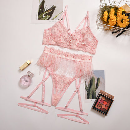 Pink embroidered lingerie set displayed flat