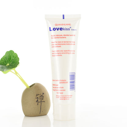 White lubricant tube beside decorative plant