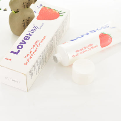 Lubricant tube with strawberry-illustrated packaging